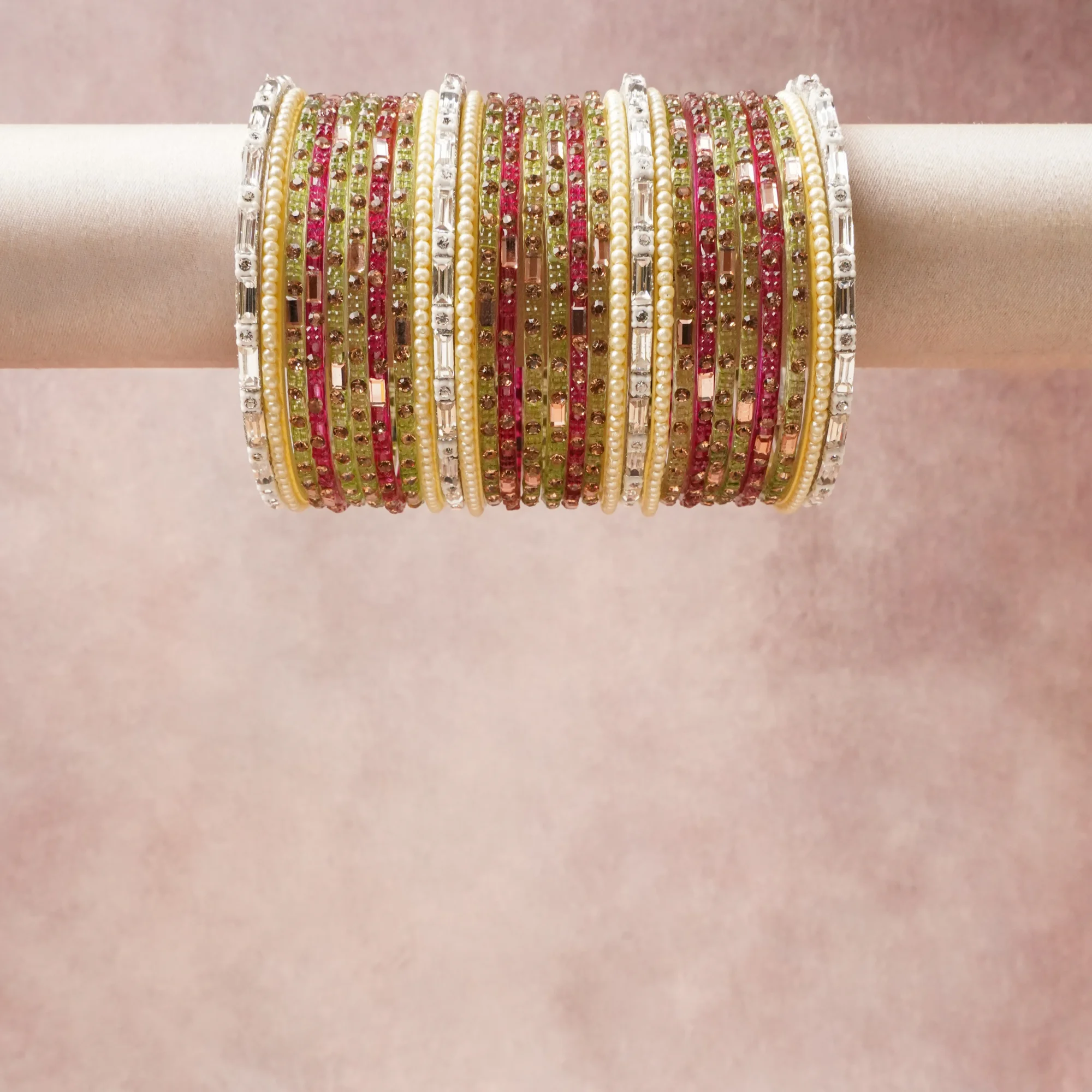 A grounding Olive Green forms the heart of the set, while touches of Cream, Clear Crystal, Rose Gold add charm.

A thoughtful composition of Glass, Faux Pearl, Metal Alloy, designed to feel complete without being heavy.
Each element layers seamlessly, creating a look that is refined, wearable and quietly striking.